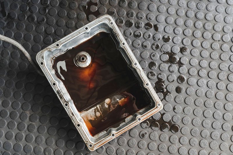 Oil pan with old, dirty fluid that was causing transmission issues
